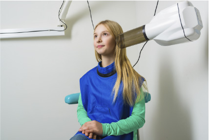 girl getting a dental x-ray
